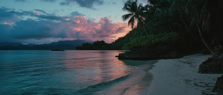 Serene sunrise over tranquil beach with gentle waves and lush palm trees