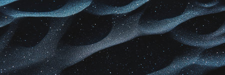 Unique black sand texture featuring white mineral traces showing a speckled patternの素材