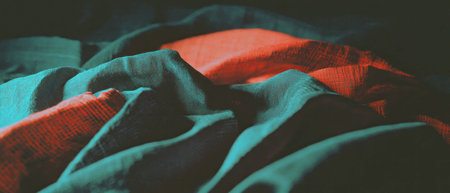 Layered fabric texture overlay showcasing rich colors and intricate patternsの素材