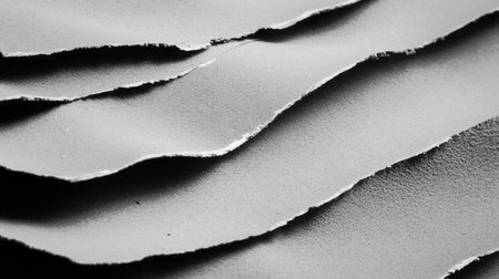 Abstract artistic texture of torn sandpaper layers representing wear and tear chaosの素材