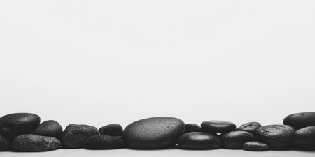 Contrasting banner with pebbles forming a border and an empty space for textの素材