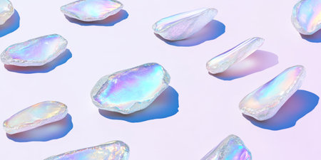 Colorful opal chips scattered on a soft pastel background with clean shadows and contrasting empty...