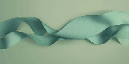 Elegant velvet ribbon on a textured background creating a contrast of softness and simplicity in designの写真素材