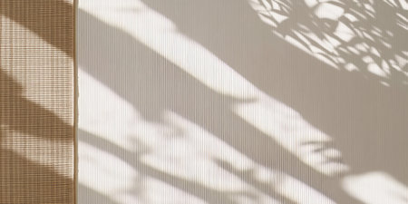 Woven mats frame a minimalistic banner with contrasting shadows creating an artistic effect in an interior settingの写真素材
