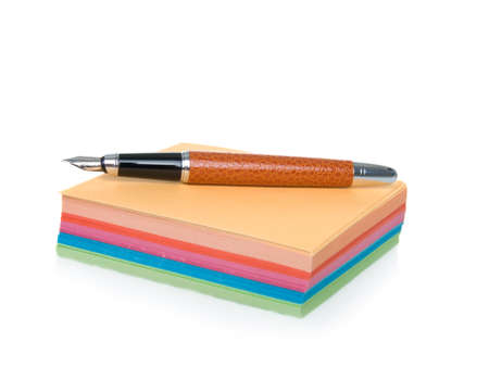 notes block and pen isolated on a white backgroundの写真素材
