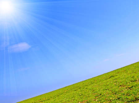 field and the blue spring skyの写真素材