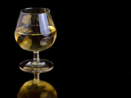 one glass white wine on black background, with room for text.の写真素材
