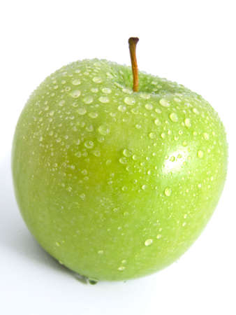 Juicy ripe green apple on a white background の写真素材