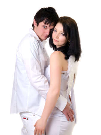 Portrait of a young handsome couple. Young man embraces woman. の写真素材