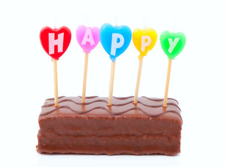 happy birthday candles on chocolate cakeの写真素材