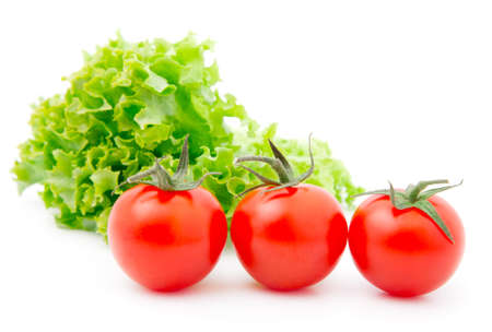 Red cherry tomato and salad lettuce の写真素材