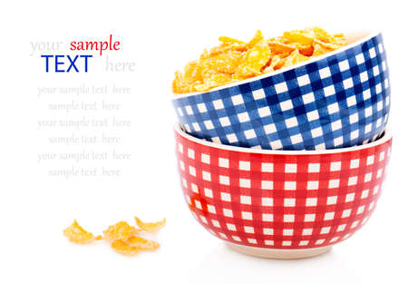 Cornflakes in a porcelain bowl, isolated on white background