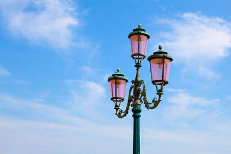 old street-lamp on blue skyの写真素材