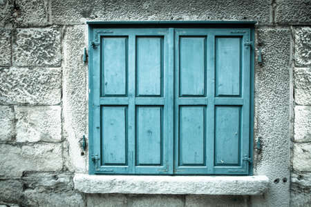 Wooden window shutters. Closed old shutteredの写真素材