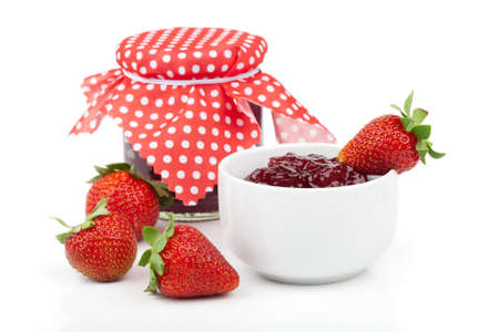 Strawberry berries and a jar of jam isolated on white backgroundの写真素材