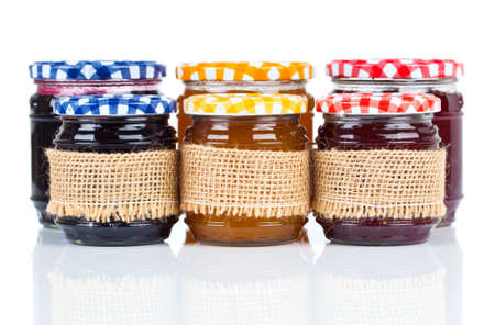 homemade jars with jam, on white background の写真素材