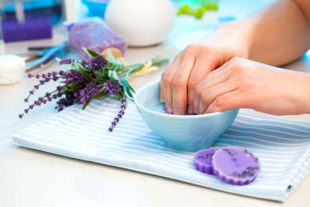 Manicure. Care of fingers of hands, cleaning, covering a varnish of nails.の写真素材
