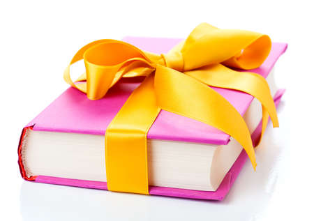 The book with a bow on a white backgroundの写真素材