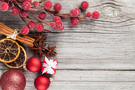 Christmas decoration on wood background, with free space for your textの写真素材