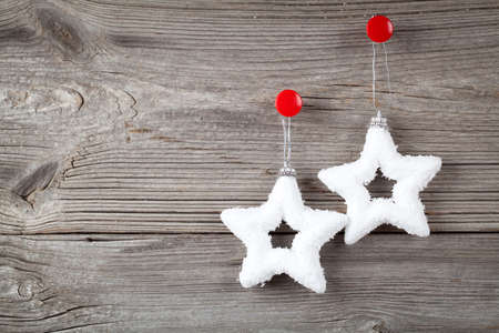 white christmas stars and sample text on wooden background