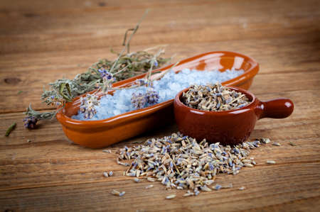 dry lavender flowers with bath salt, on wooden .の写真素材