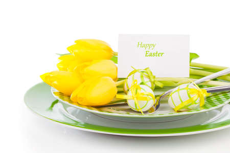 Easter eggs and blank for text in a plate, on a white background