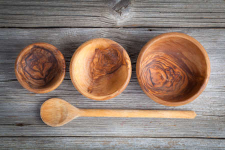 Wooden kitchen utensils on wooden backgroundの写真素材