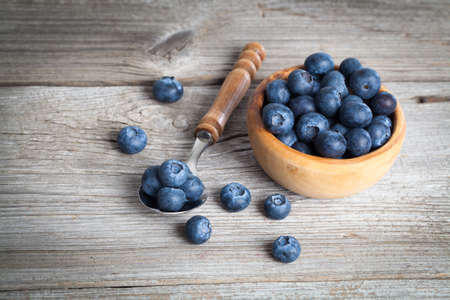 bowl of blueberries on wooden backgroundの写真素材