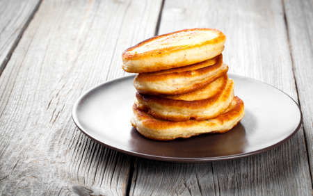 Stack of pancakes on wooden backgroundの写真素材