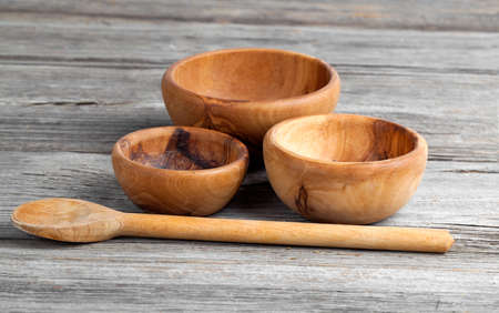 Wooden kitchen utensils on wooden backgroundの写真素材