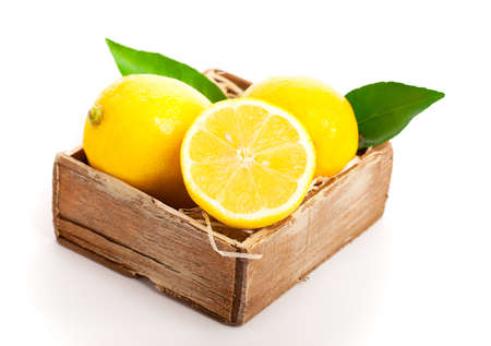 Wooden box full of lemonsの写真素材