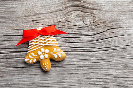 Gingerbread cookie on wooden background. Christmasの写真素材
