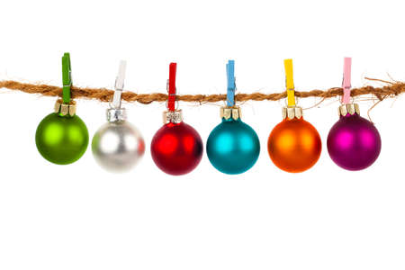 Christmas bauble collection hang on rope, isolated on white backgroundの写真素材