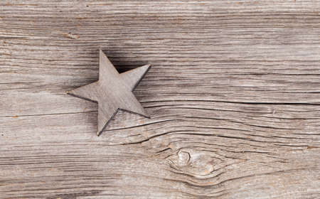 Old xmas star on wooden vintage backgroundの写真素材