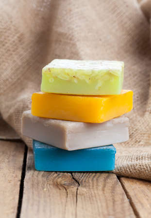colorful handmade soap bars, on wooden backgroundの写真素材