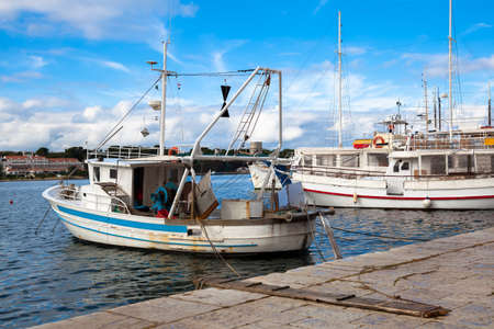 Fishing boat in harborの写真素材