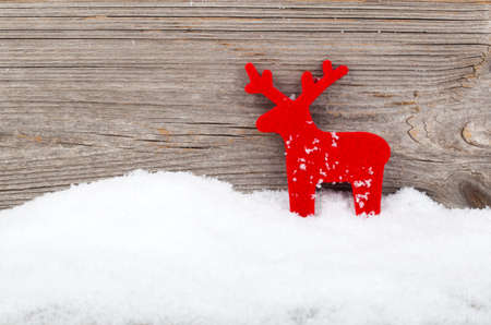 Christmas deer decoration, over wooden backgroundの写真素材