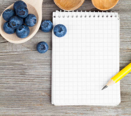 Workout and fitness dieting copy space diary. Healthy lifestyle concept. blueberry berry on rustic wooden table.の写真素材