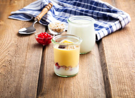 natural yoghurt on a wooden backgroundの写真素材