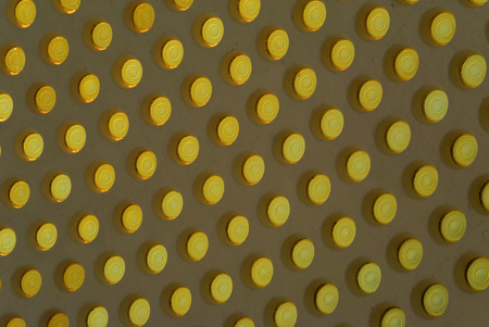 Dotted background of the colorful circles, yellow geometric pattern. Abstract modern design background. Photo of stained-glass windows in roof.の写真素材