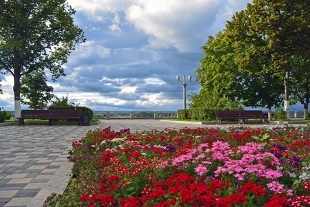 View on the Volga quay of the Samara. Flowerbed on city embankment park alley before rain at cloudy autumn dayの写真素材