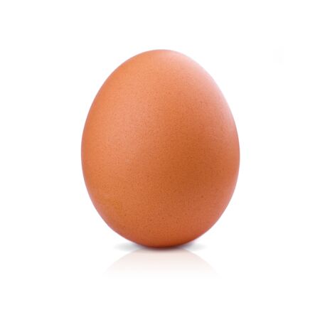 One brown chicken egg isolated on white background with clipping path. Closeup macro boiled vertical...