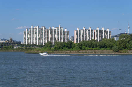 modern apartment building of Seoul with sailing motor boatのeditorial素材