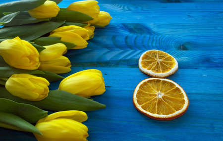 banner for woman's day concept with yellow tulips and 8 made of orange slicesの写真素材
