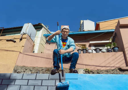 BUSAN, SOUTH KOREA, MAY 01, 2017: sculpture of a man painting a wall at Gamcheon culture village...