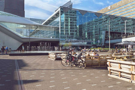 Hague, The Netherlands, October 14, 2018: Square near central station of Hague with fountain and people relaxing on sunny sunday dayのeditorial素材