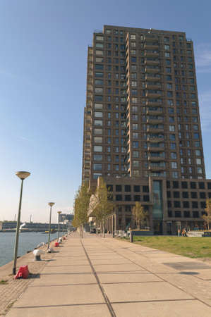 Rotterdam, The Netherlands, October 6, 2018: Modern building in Rotterdam with street alley and river viewのeditorial素材