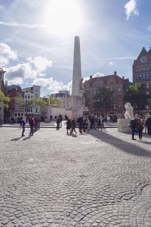 Amsterdam, The Netherlands, October 07, 2018: White travertine monument with relief sculpting & the national site for the remembrance of WWII on the square of Amsterdamのeditorial素材