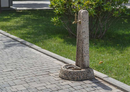 bronze faucet to drink water outdoorの写真素材