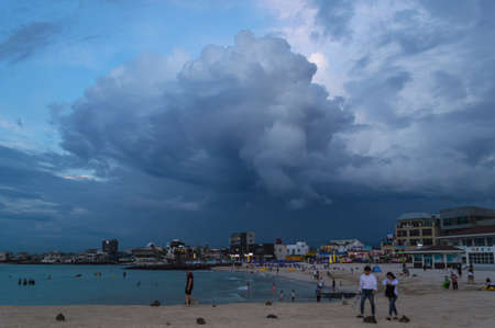Jeju Island, South Korea, september 05, 2019: people at Hyeopjae Beach in the evening before storm...